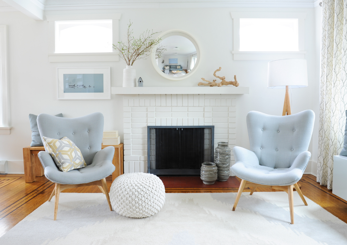 Simply-Home-Decorating-Vancouver-Canada-Fireplace-Remodel-Classic-White-Brick-Blue-Accent-Chairs