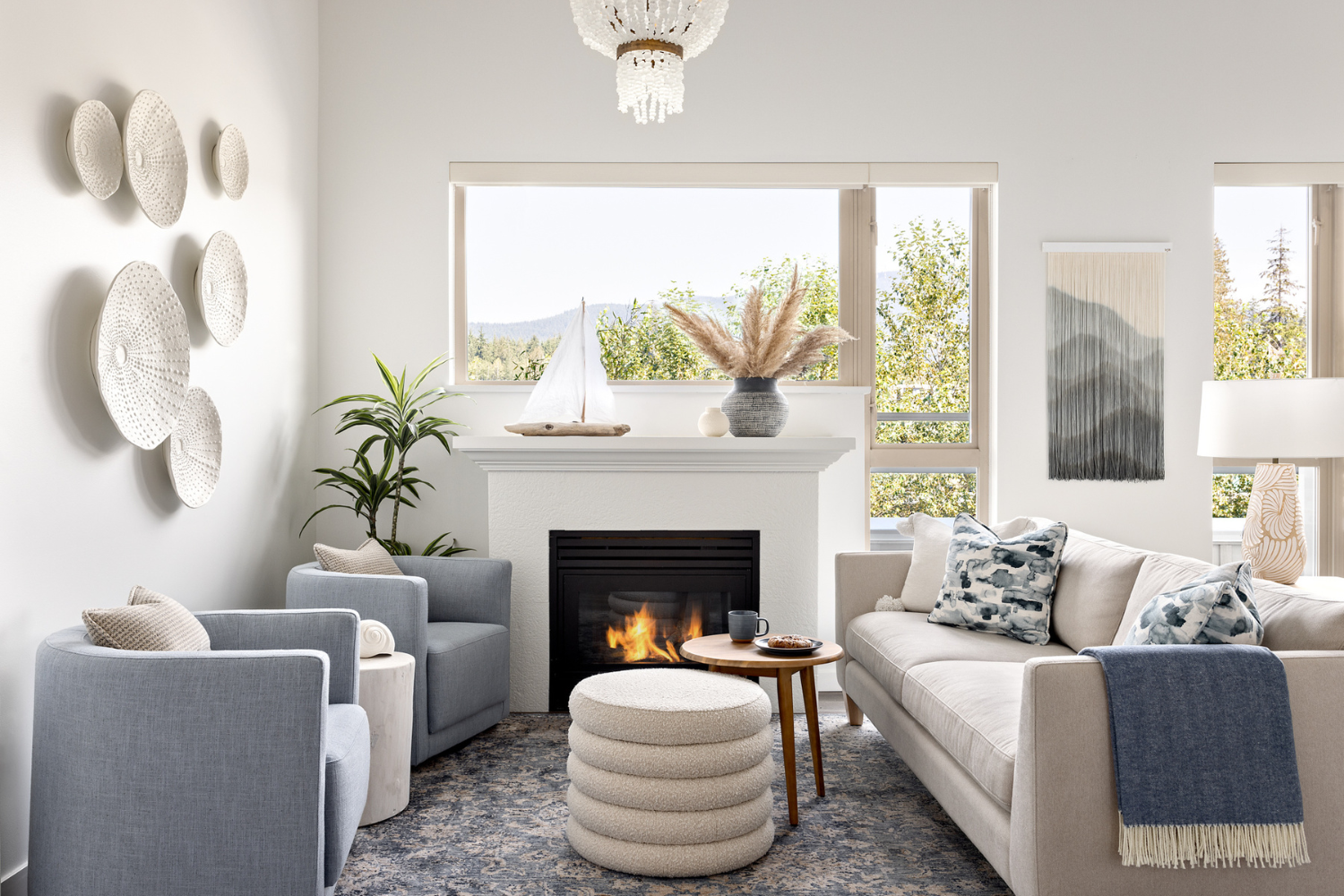 Simply-Home-Decorating-Cozy-Living-Room-Vancouver-Neutral-Sofa-Light-Blue-Accent-Chairs-Fireplace-Textured-Wall-Decor