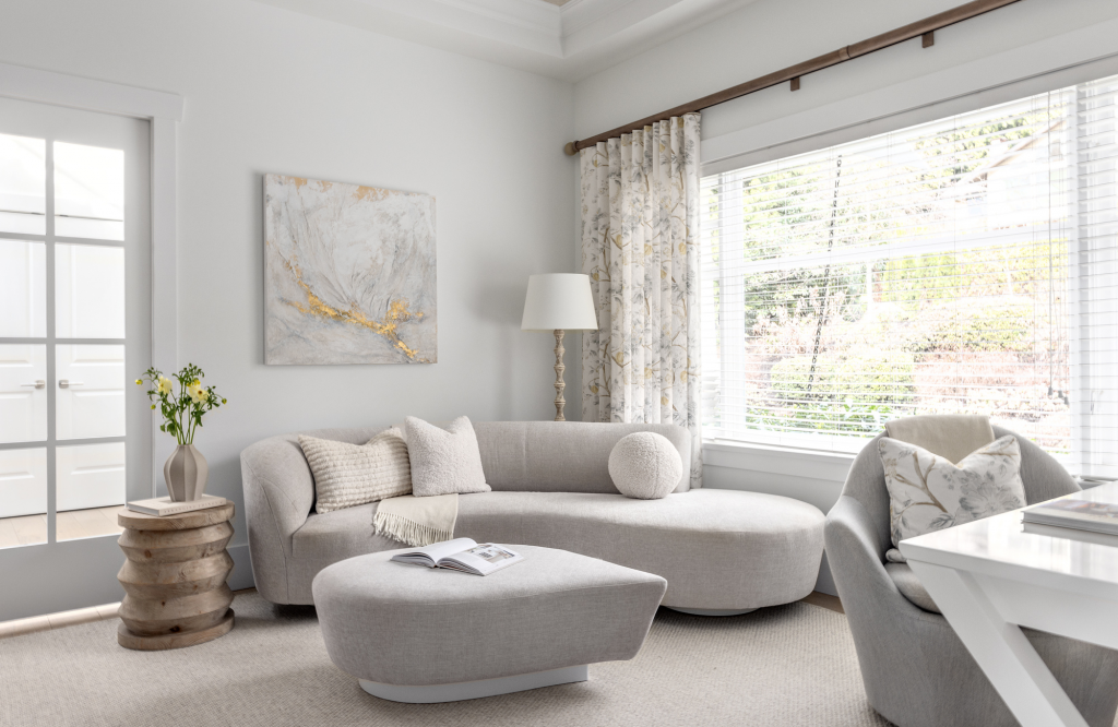 full-service-interior-designer-lions-bay-bc-designing-a-home-for-your-passions-sofa-with-soft-curves-neutral-colours-by-large-window-everyday-luxury