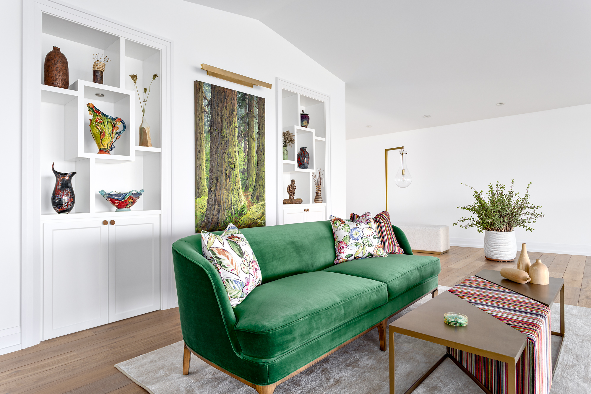 full-service-interior-designer-lions-bay-vancouver-lessons-in-entrepreneurship-emerald-green-sofa-in-living-room-colorful-throw-pillows-built-in-shelves-custom-home-renovation