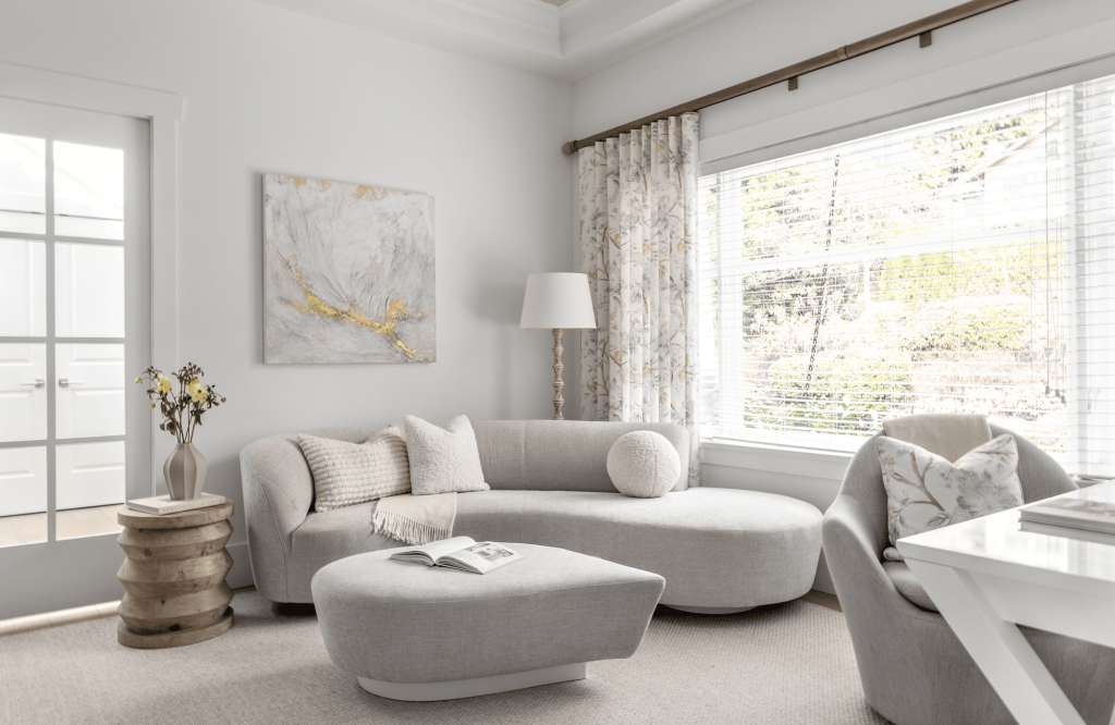 simply-home-decorating-north-vancouver-statement-pieces-interior-design-sofa-with-soft-curves-neutral-colours-by-large-window-everyday-luxury