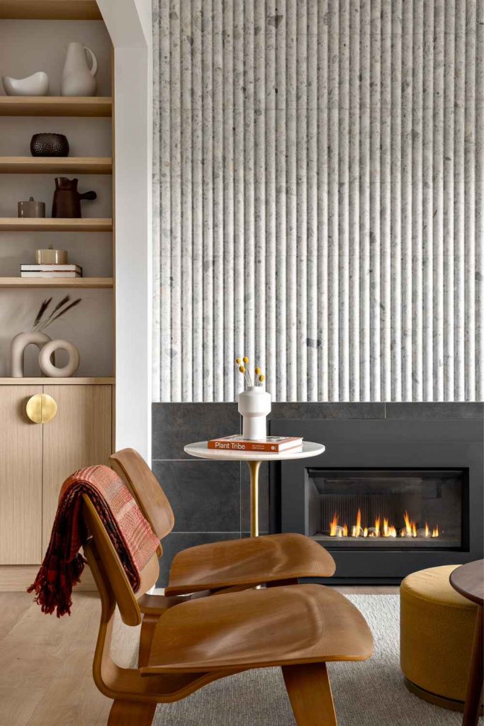 simply-home-decorating-north-vancouver-bc-home-furnishing-timeline-modern-living-room-textured-fireplace-wall-low-wooden-chairs-clean-lines-elevated-home-renovation