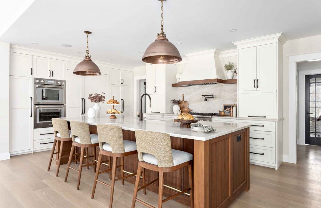simply-home-decorating-newfoundland-project-coast-to-coast-home-renovation-copper-pendand-lights-seagrass-counter-stools-timeless-kitchen-renovation