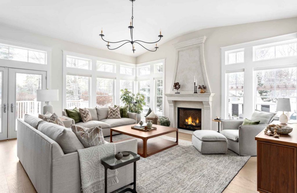 simply-home-decorating-newfoundland-project-coast-to-coast-home-renovation-olive-green-throw-pillow-grey-wool-area-rug-refined-classic-living-room-design