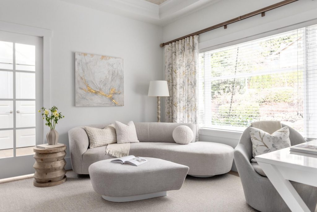 interior-design-home-furnishings-north-vancouver-incorporating-artwork-into-your-home-living-room-with-high-quality-custom-furniture-curved-sofa-neutral-colours-timeless
