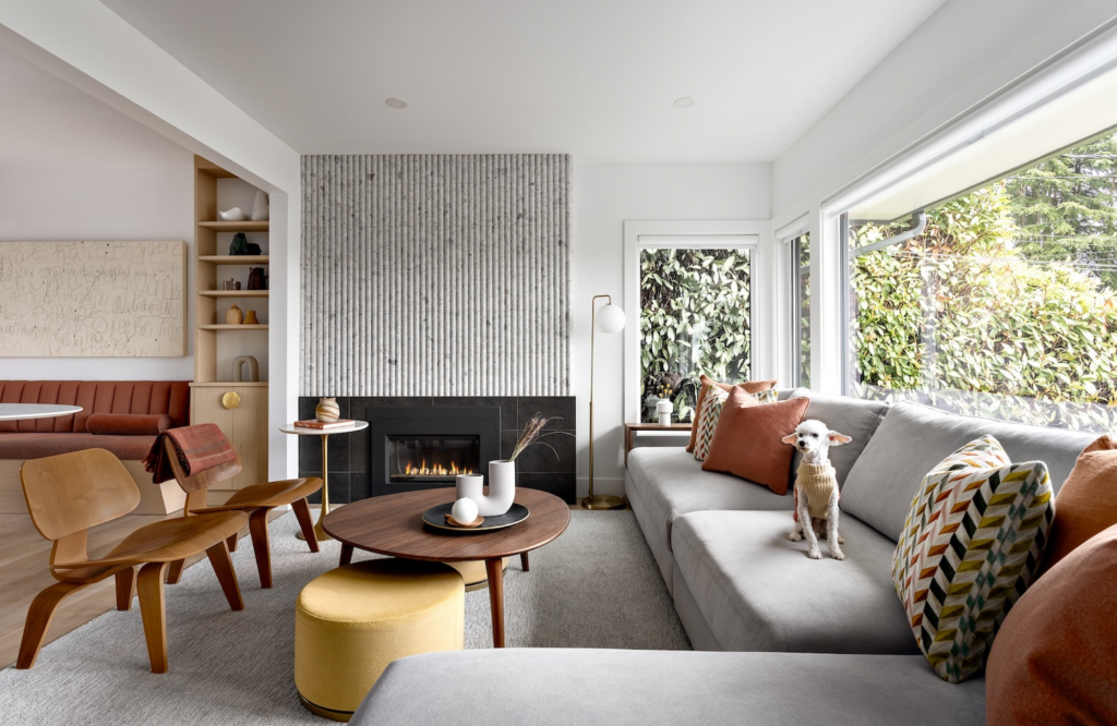 modern-west-vancouver-home-large-area-rug-gray-dog-on-sofa-earth-toned-colours-simply-home-decorating