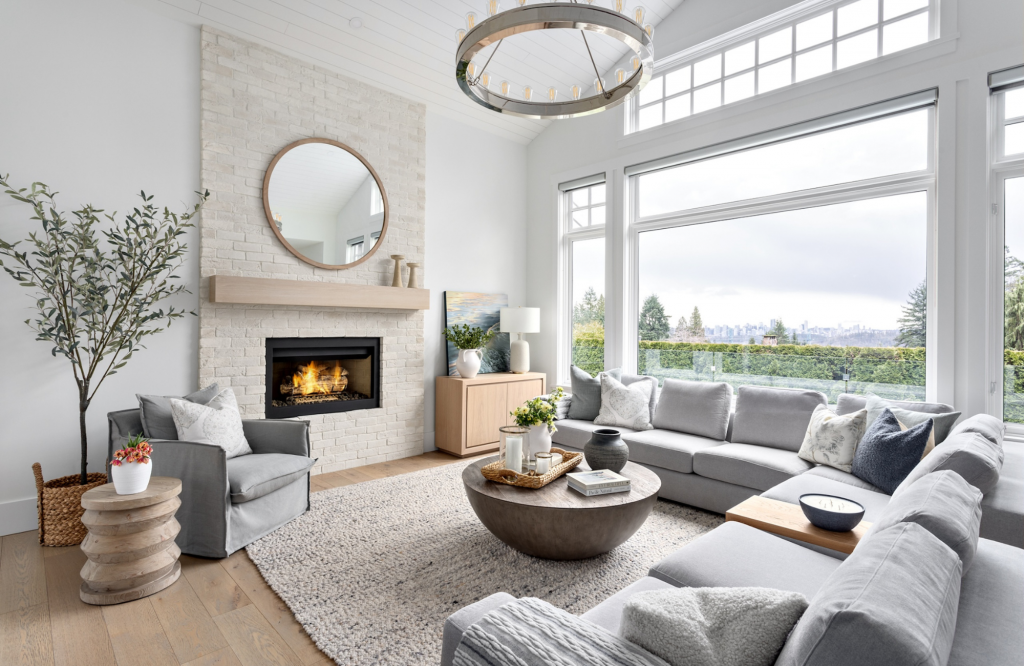 simply-home-decorating-canadian-coastal-home-design-wool-area-rug-stone-fireplace-neutral-sofas