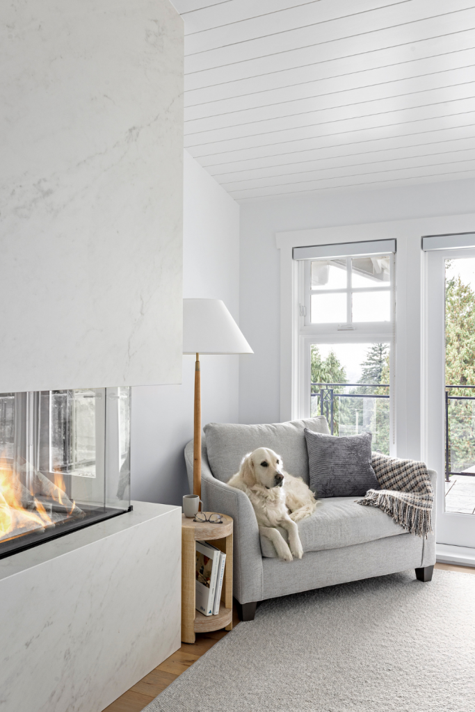 primary-bedroom-fireplace-vancouver-interior-design-cozy-chair-nook-dog-friendly-designer-simply-home-decorating
