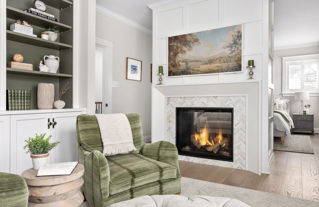 simply-home-decorating-blueridge-home-furnishing-plans-upholstered-green-chair-by-fireplace-built-in-cabinets-living-room-elevated