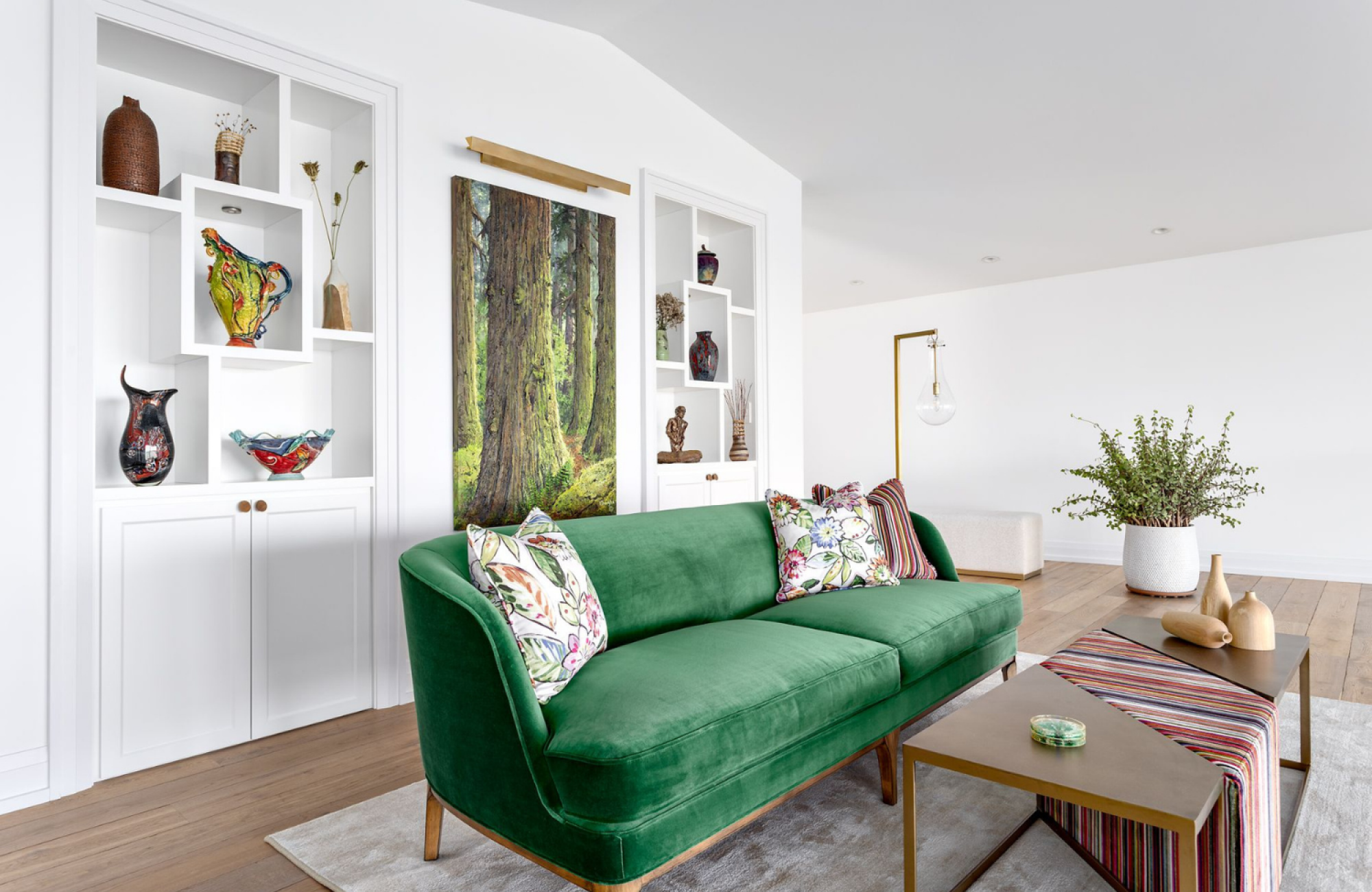 furnish a whole home green sofa custom recessed shelving warm tree artwork nature inspired home