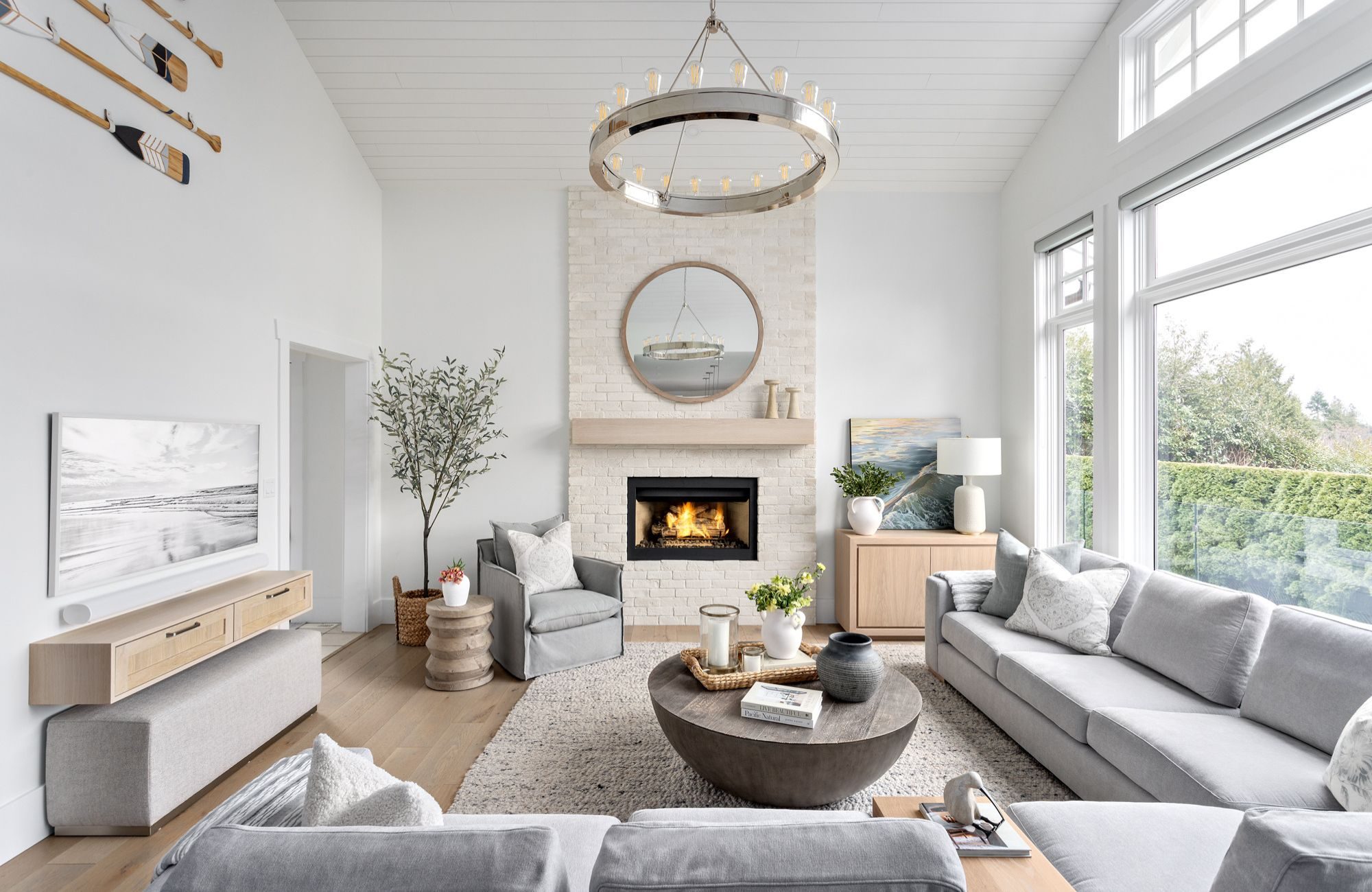 simply-home-decorating-edgemont-vancouver-home-furnishing-plans-living-room-soft-colours-round-light-fixture-and-mirror-natural-light-timeless