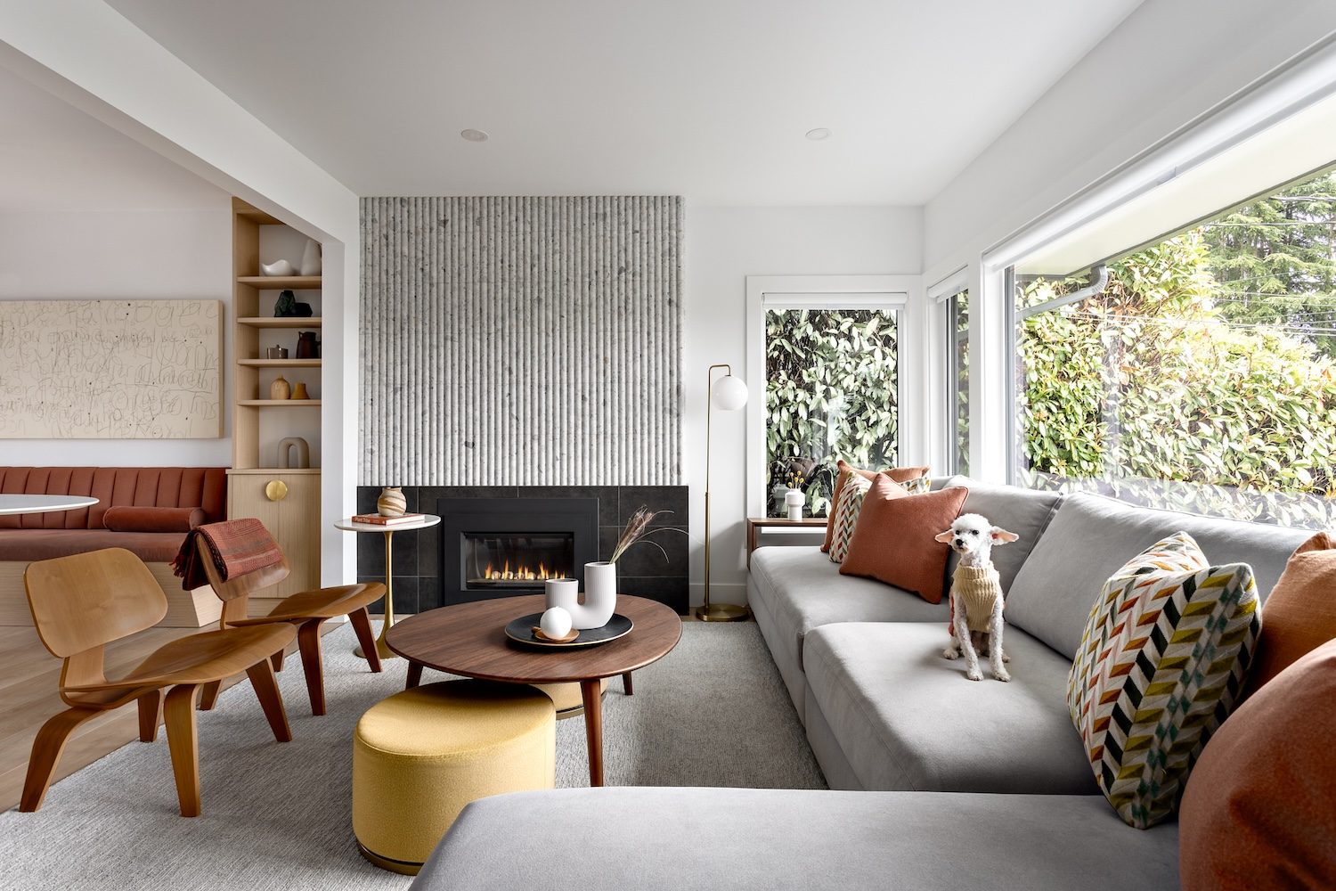 simply-home-decorating-west-vancouver-bc-ca-a-mid-century-modern-home-fluted-tile-fireplace-and-vintage-bent-wood-eames-chairs-modern-interior-design