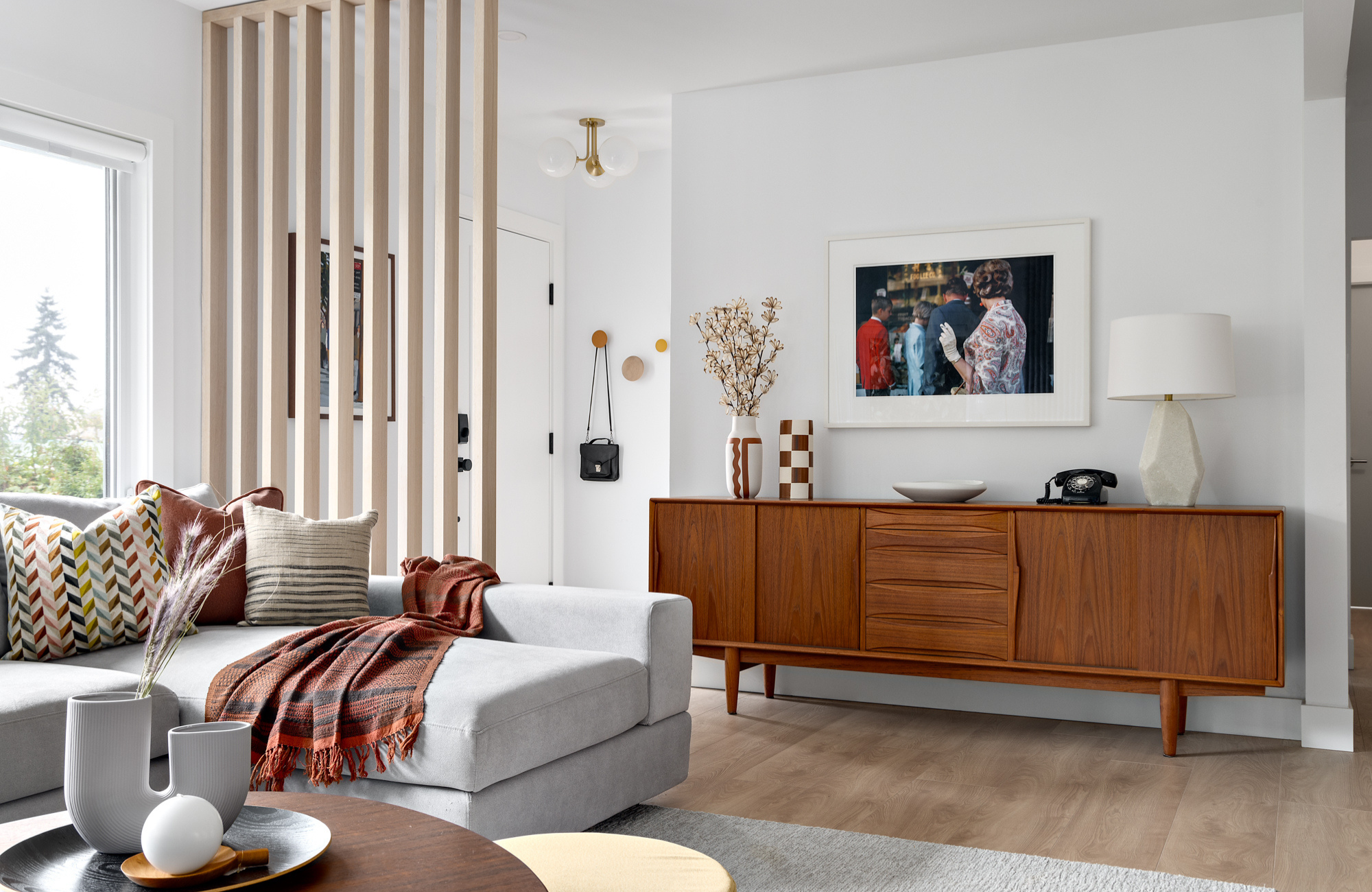 vancouver-interior-designer-defined-entryway-walnut-ideboard-oak-flooring-colourful-artwork-designer-support